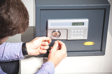 Professional locksmith installing and maintaining a secure safe for home or business protection.