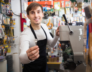 Smiling locksmith providing professional services in Downtown Vancouver, ready to assist with lock installation, repair, and emergency lockouts.