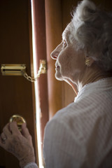 Happy senior woman feeling safe at home