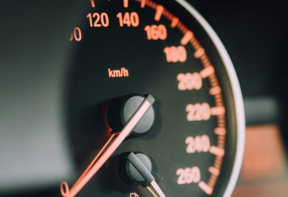 closeup photo of black analog speedometer