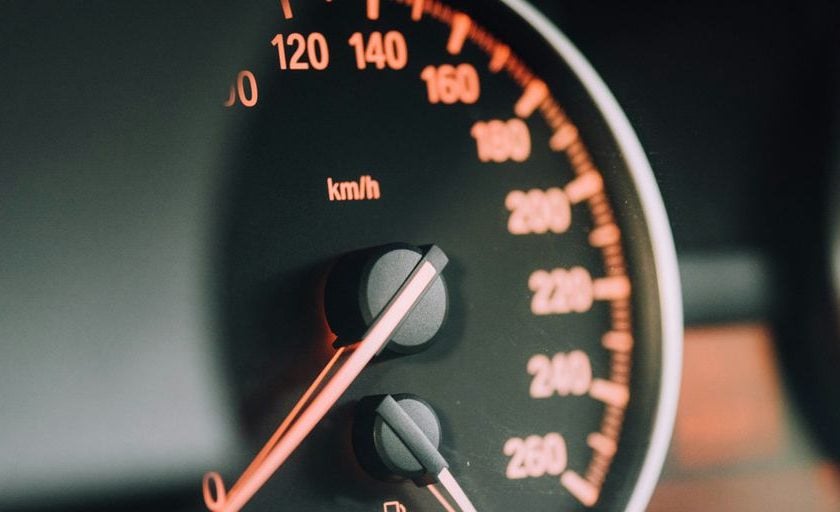 closeup photo of black analog speedometer