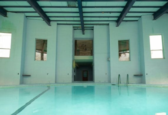 a large indoor swimming pool in a building