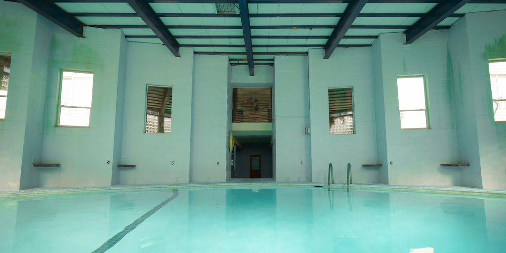 a large indoor swimming pool in a building