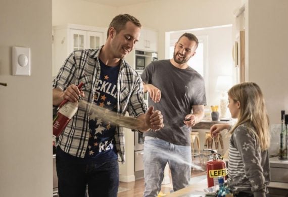 Family practicing fire safety drills at home.