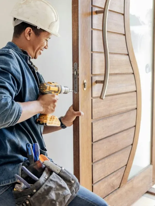 locksmith-man-and-maintenance-handyman-with-home-renovation-and-fixing-change-door-locks-with-po.jpg